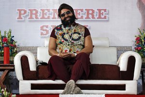 Indian spiritual leader turned actor Gurmeet Ram Rahim, gestures during the premiere of movie ‘Jattu Engineer’ in New Delhi, India, Wednesday, May 17, 2017.