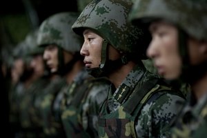 Soldiers of the Chinese People's Liberation Army 1st Amphibious Mechanized Infantry Division prepare to provide Chairman of the Joint Chiefs of Staff Adm. Mike Mullen with a demonstration of their capablities during a visit to the unit in China