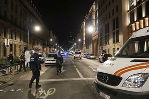 Police secure the scene in downtown Brussels after a reported attack on Belgian Army soldiers on Friday, Aug. 25, 2017.