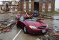 A damaged car sits outside a heavily damaged apartment complex in Rockport, Texas, after Hurricane Harvey struck the area.