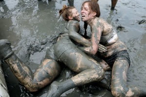 BORYEONG, SOUTH KOREA - JULY 22: Festival-goers enjoy the mud during the annual Boryeong Mud Festival at Daecheon Beach ...