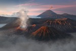 A view of Mount Bromo and Mount Semeru spewing ashes while Mount Batok remains inactive in the island of Jawa, Indonesia.