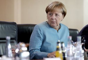 German Chancellor Angela Merkel, looks on as she arrives for the weekly cabinet meeting at the Chancellery in Berlin, Germany, Wednesday, Aug. 23, 2017.