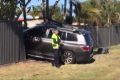 The athlete was taken to hospital after crashing into the fence at Mermaid Waters.