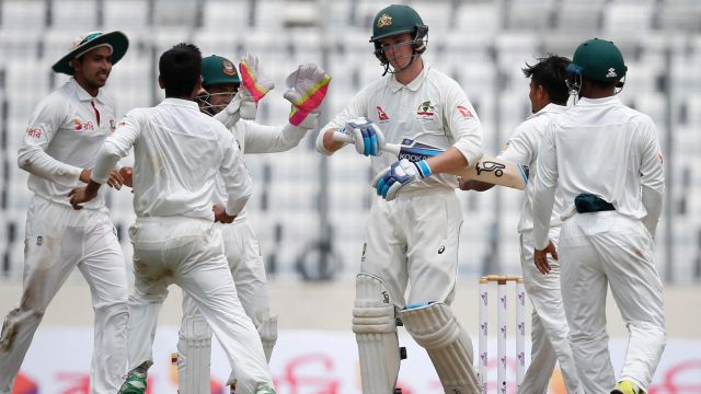 Bangladesh's Taijul Islam, second from right, celebrates with his teammates after the dismissal of Australia's Peter ...