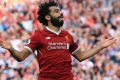 Mohamed Salah of Liverpool celebrates scoring his side's third goal.