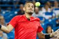 Nick Kyrgios, of Australia, returns to Rafael Nadal, of Spain, at the Western & Southern Open tennis tournament, Friday, ...