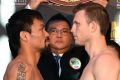 Face off: Manny Pacquiao and Australia's Jeff Horn at the weigh-in.