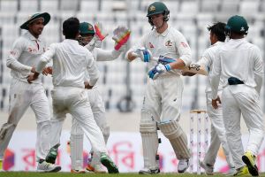 Bangladesh's Taijul Islam, second from right, celebrates with his teammates after the dismissal of Australia's Peter ...