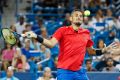 Nick Kyrgios, of Australia, returns to Rafael Nadal, of Spain, at the Western & Southern Open tennis tournament, Friday, ...