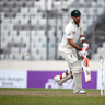 Bangladesh's wicketkeeper captain Mushfiqur Rahim, right, breaks the wickets successfully to dismissal of Australia's Glenn Maxwell, left, during the second day of their first test cricket match in Dhaka, Bangladesh, Monday, Aug. 28, 2017. (AP Photo/ A.M. Ahad)