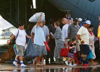 Evacuees from Tropical Storm Harvey arrive at Dallas Love Field on a military aircraft in Dallas on Monday, Aug. 28, 2017.