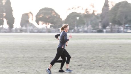 Joggers on a frosty morning in Princes Park Carlton.