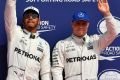 Top spot: Lewis Hamilton stands on the podium with Valtteri Bottas after the qualifying session ahead of the Belgian ...