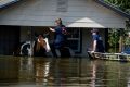 Beaumont firefighters rescue two horses stranded in floodwaters from Hurricane Harvey in Beaumont, Texas, on Thursday.