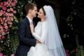 Evan Spiegel and Miranda Kerr, dressed in Dior, on their wedding day.