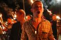 White nationalist groups march with torches through a university campus in Charlottesville.