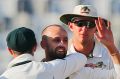 All-time great: Australia's Nathan Lyon, second from left, after dismissing Bangladesh's Taijul Islam.