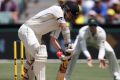 New Zealand's Tom Latham plays at the ball during the first session of a day-night test against Australia in Adelaide. 