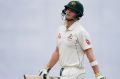 Australian cricket team captain Steve Smith walks back to the pavilion after his dismissal by Bangladesh's Mehedi Hasan ...