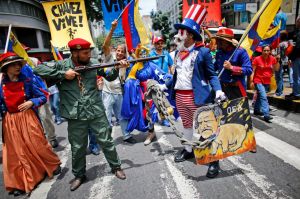 Government supporters perform a parody involving a Venezuelan militia up against Uncle Sam, a personification of the U.S ...