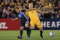 Aaron Mooy of Australia and Genki Haraguchi of Japan contests possession during last year's World Cup qualifier game  at ...