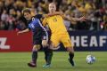 Rematch: Aaron Mooy and Japan's Genki Haraguchi battle hard for the ball during last year's World Cup qualifier in Melbourne.