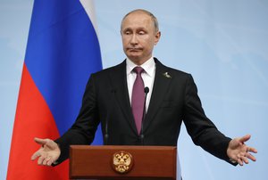 Russian President Vladimir Putin speaks during a press conference after the G-20 summit in Hamburg, northern Germany, Saturday, July 8, 2017