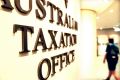The Tax Office is fighting with the Australian Services Union over a trial of hot-desking at two offices.