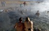 Tourists bathe in hot springs near the small village of Agua Brava, more than 4000 meters above sea level, in the Uyuni ...