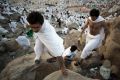 Muslim pilgrims climb Jabal Al Rahma holy mountain, or the mountain of forgiveness, at Arafat for the annual hajj ...