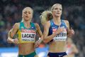 Genevieve LaCaze, United States' Emma Coburn and Kenya's Celliphine Chepteek Chespol cross the line.
