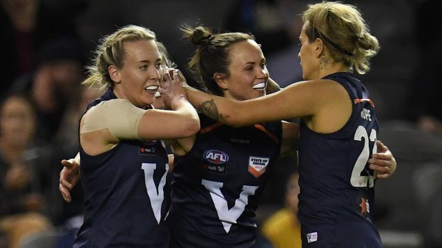 Lauren Arnell, Daisy Pearce and Moana Hope celebrate a Big V goal