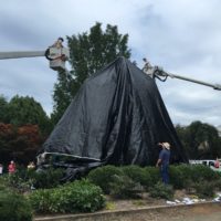 The city covered Emancipation Park's General Robert E. Lee memorial with a giant black tarp. Staff photo