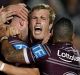 Fired up: Curtis Sironen celebrates with teammates after adding another four-pointer.