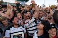 Alive and well: Warringah players and fans celebrate their Shute Shield success.