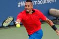 Nick Kyrgios, of Australia, returns to Grigor Dimitrov, of Bulgaria, during the men's singles final at the Western & ...