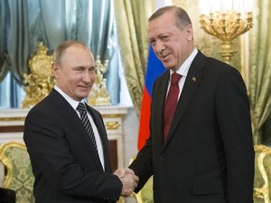 Russian President Vladimir Putin, left, shakes hands with Turkey's President Recep Tayyip Erdogan during their meeting in the Kremlin in Moscow, Russia, Friday, March 10, 2017. The talks focused on Syria, where Russia and Turkey have launched a joint mediation effort and coordinated their military action against the Islamic State group