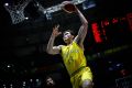 Boomers centre Angus Brandt goes up for a left-handed dunk against Hong Kong.