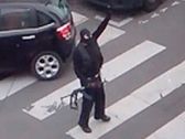 Said and Cherif Kouachi return to their car after the attack outside the offices of French satirical weekly newspaper Charlie Hebdo, January 7, 2015.