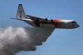 The large air tanker C-130 Hercules "Thor" does a water drop fly-by as fire authorities gear up for an early and active ...