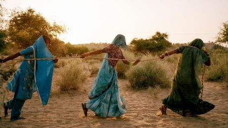 Women pull water from a well in the Thar desert, where temperatures hover between 48°C and 50°C on summer days.