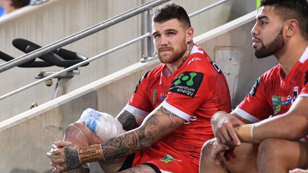 Hobbled: Josh Dugan looks on after sustaining an injury against the Titans.