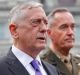 Defense Secretary Jim Mattis, left, accompanied by Joint Chiefs Chairman General Joseph Dunford, right, speaks to ...