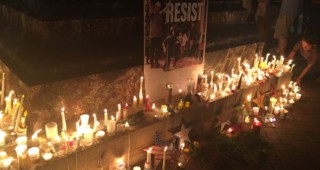 Community members placed their candles at the foot of the Thomas Jefferson statue where white nationalists surrounded about 20 counterprotesters during their August 11 tiki torch rally. Staff photo