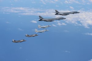 Marine Corps F-35B Lightning II stealth fighters assigned to the Marine Corps Air Station Iwakuni, Japan, fly alongside two Air Force B-1B Lancers assigned to the 37th Expeditionary Bomb Squadron, deployed from Ellsworth Air Force Base, South Dakota, over waters near Kyushu, Japan, August 30, 2017. The F-35Bs and B-1Bs made contact with two Japan Air Self-Defense Force Koku Jieitai F-15J fighters in Japanese airspace in direct response to North Korea’s intermediate range ballistic missile launch.