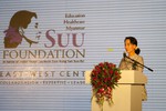 File - Nobel Peace Prize laureate Daw Aung San Suu Kyi addresses the participants of the East-West Center International Media Conference at a special pre-conference luncheon and announced the launch of the Suu Foundation, a humanitarian organization dedicated to advancing the health and education of the people of Myanmar (Burma).