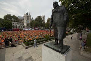 Some 2500 lifejackets worn by refugees who made the sea crossing from Turkey to the Greek island of Chios are displayed in what the organisers called a "Lifejacket Graveyard" in Parliament Square, London, beside a statue of former British Prime Minister Sir Winston Churchill, Monday, Sept. 19, 2016.