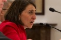 Premier Gladys Berejiklian addresses the Senate Estimates Committee, flanked by John Schmidt, and Blair Comley, at NSW ...