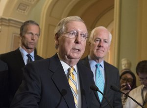 Senate Majority Leader Mitch McConnell, R-Ky., center, joined by Sen. John Thune, R-S.D., left, and Majority Whip John Cornyn, R-Texas, holds a news conference at the Capitol after President Donald Trump overruled congressional Republicans and his own treasury secretary and cut a deal with Democrats to fund the government and raise the federal borrowing limit for three months, all part of an agreement to speed money to Harvey relief, in Washington, Wednesday, Sept. 6, 2017.